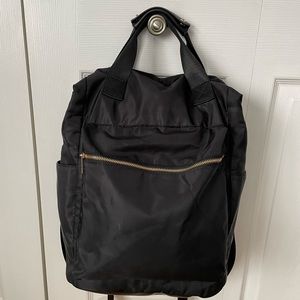 Black Backpack with gold tone zippers